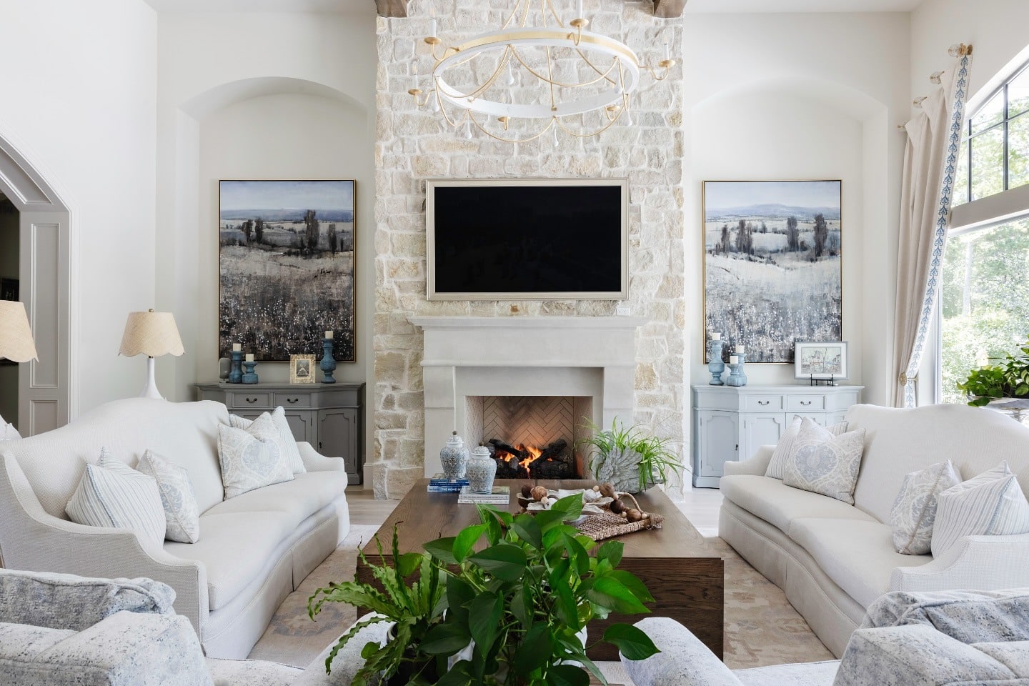 4. Timeless Light with Neutral Stone - stone fireplace living room ideas