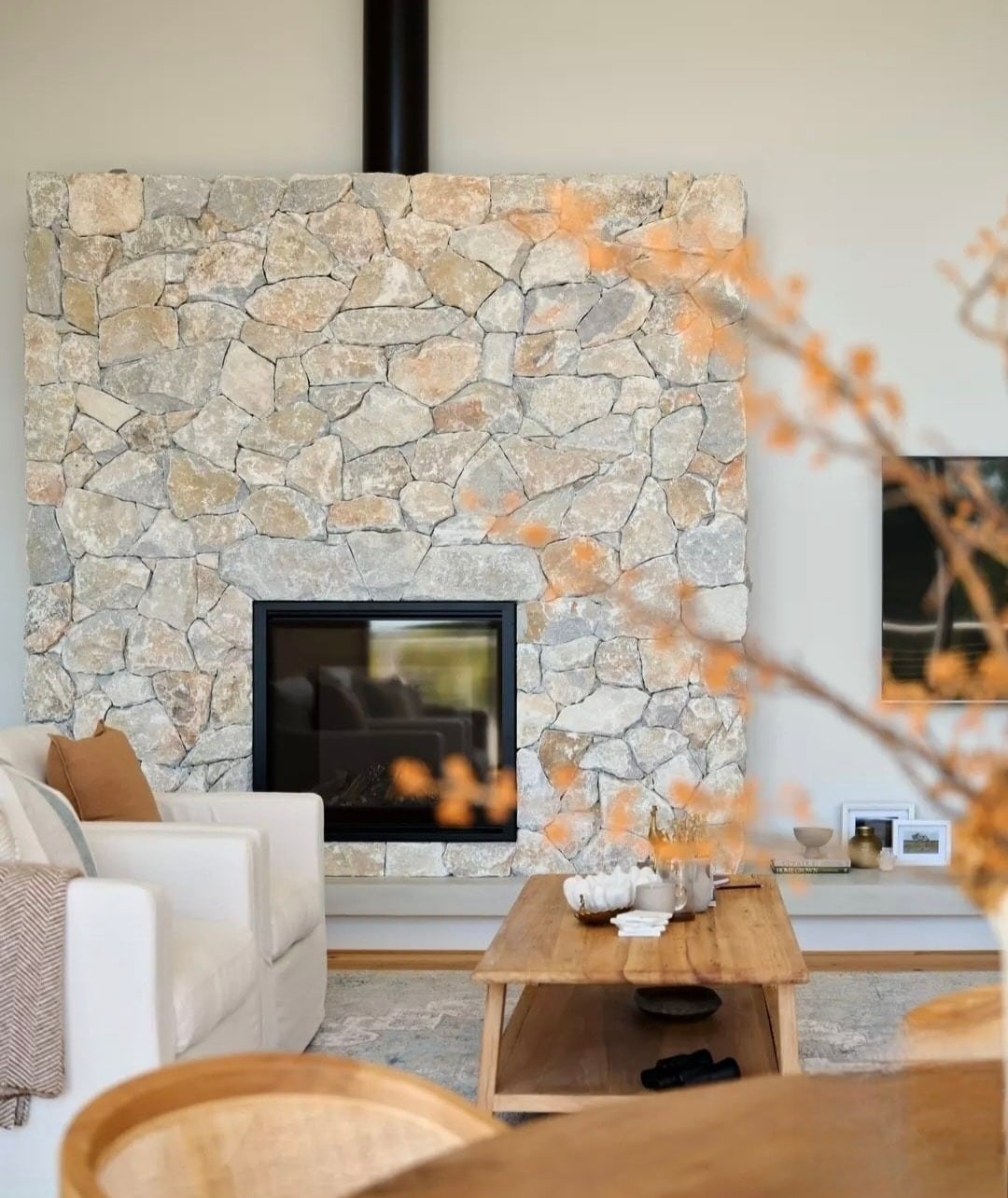 7. Casual Sophistication with Natural Stone - stone fireplace living room ideas