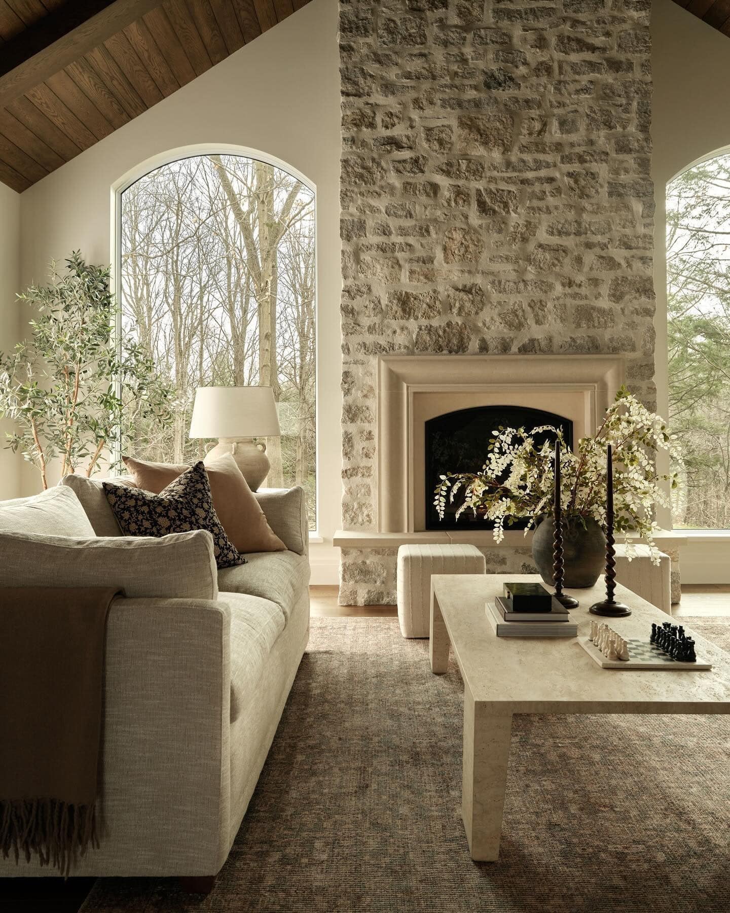 13. Organic Comfort with Earthy Stone - stone fireplace living room ideas