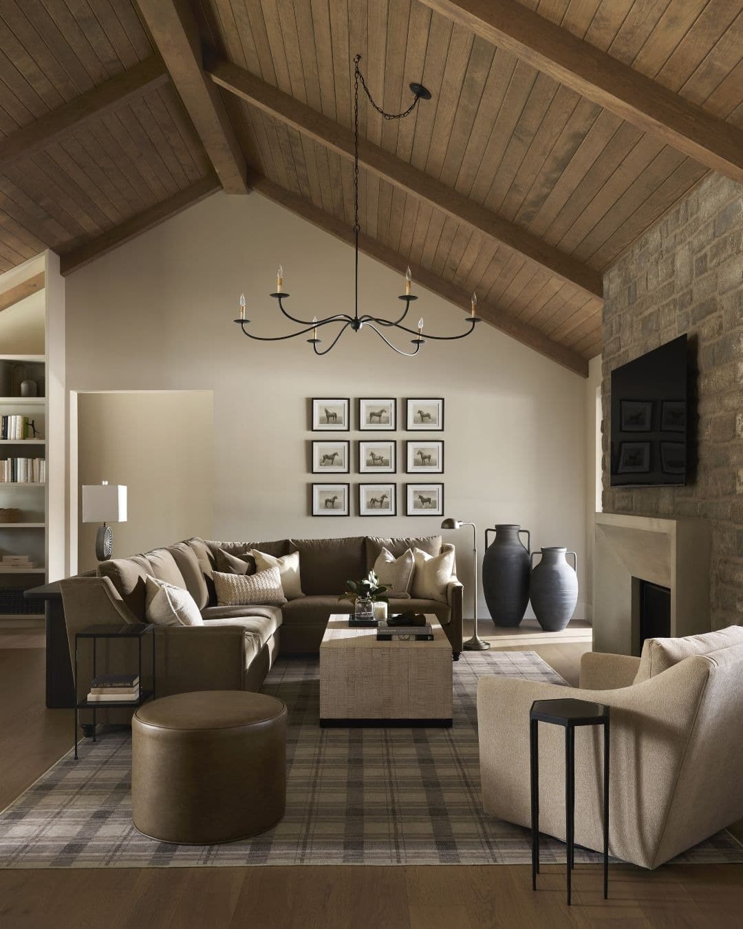 14. Rustic Harmony with Vaulted Ceilings - stone fireplace living room ideas