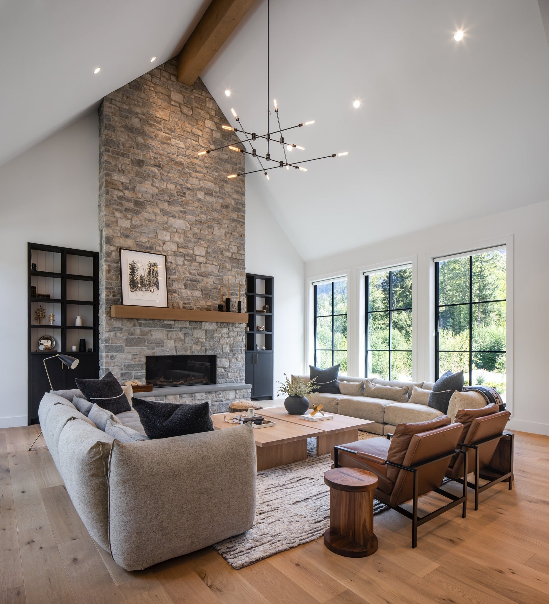 16. Elevated Comfort with Towering Stone - stone fireplace living room ideas