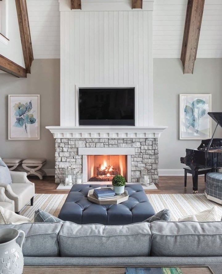 17. Crisp Contrast with White Paneling - stone fireplace living room ideas