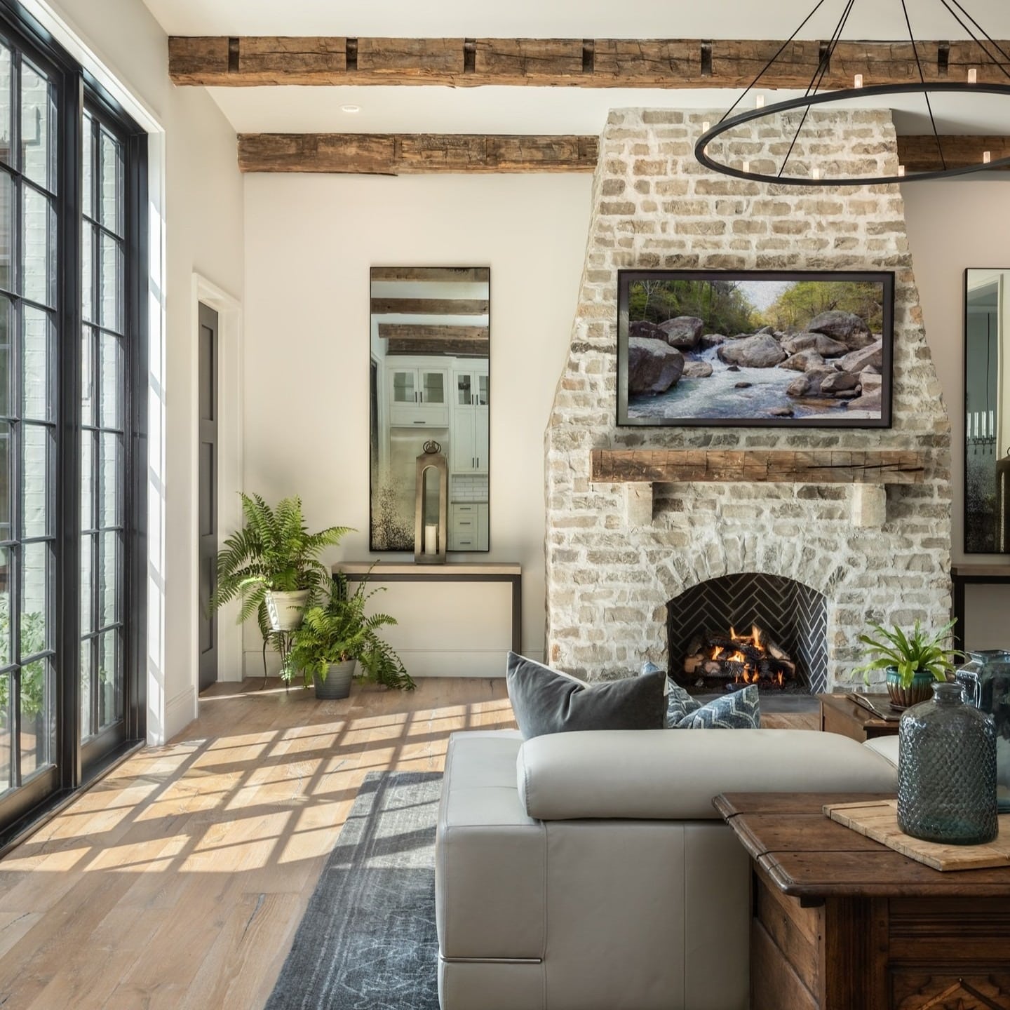 18. Classic Balance with Aged Stone - stone fireplace living room ideas