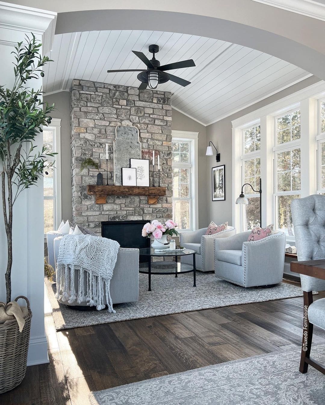 22. Farmhouse Charm with Weathered Stone - stone fireplace living room ideas
