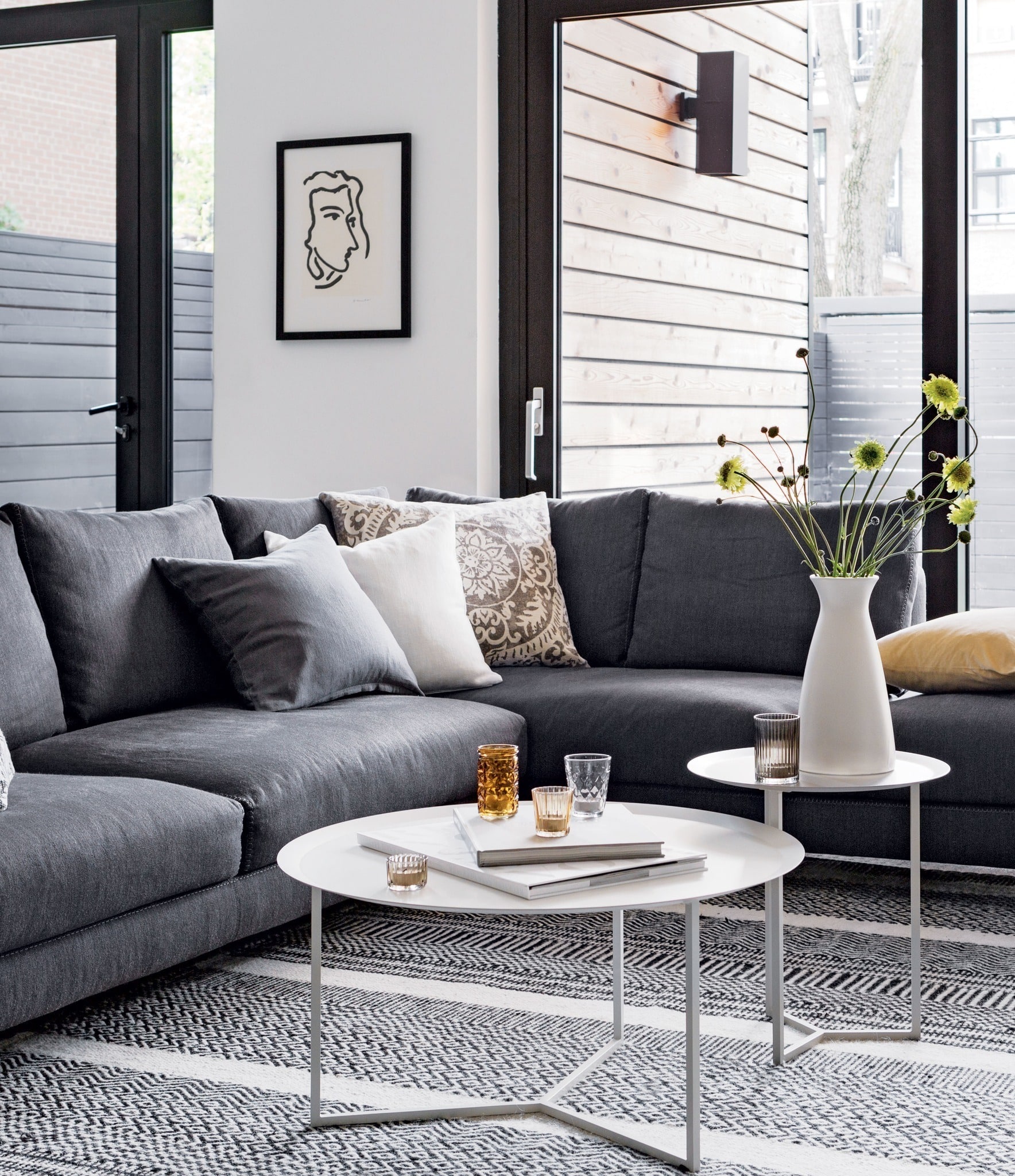 2. Modern Comfort with Graphic Layers - grey floor living room ideas