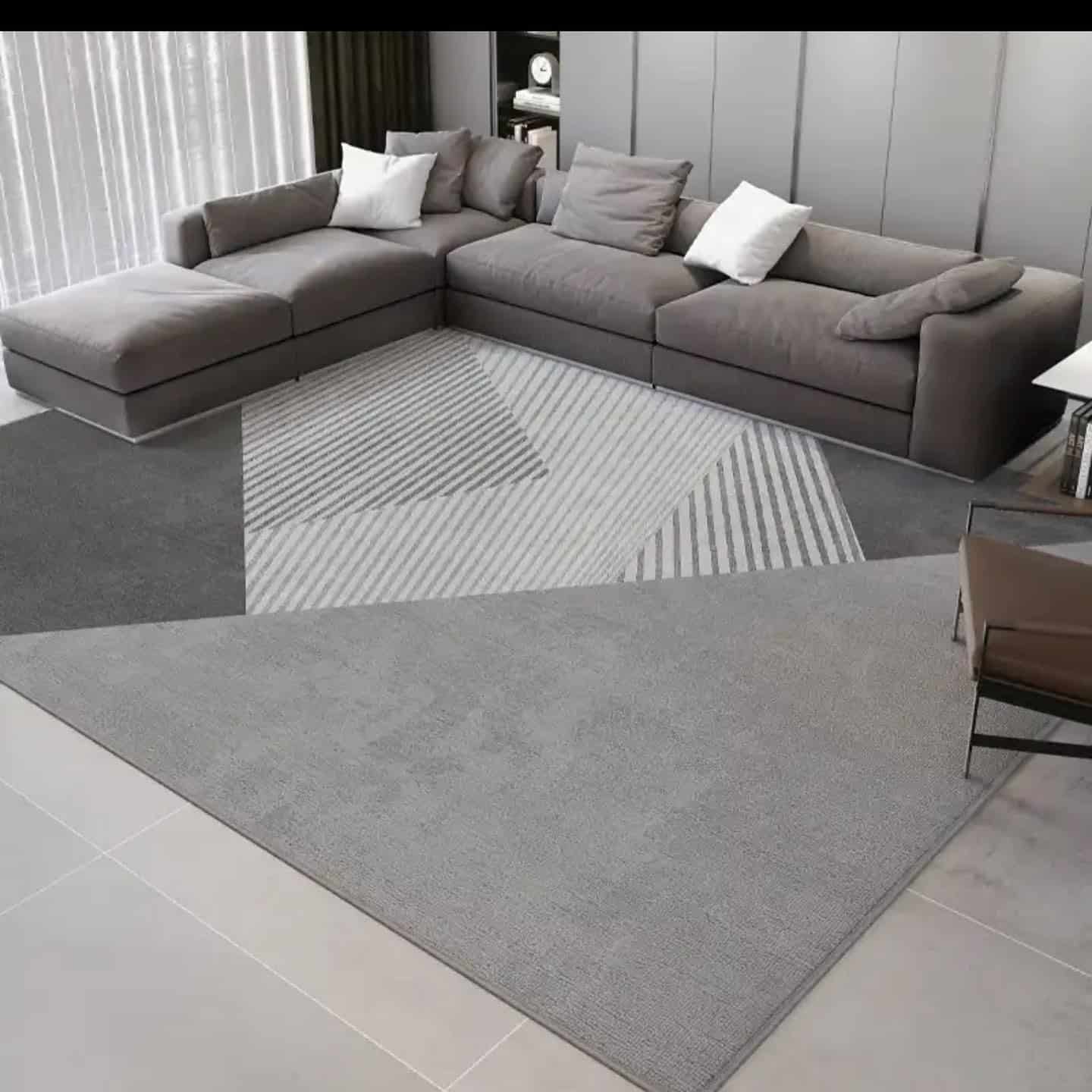 4. Geometric Statement with Subtle Drama - grey floor living room ideas