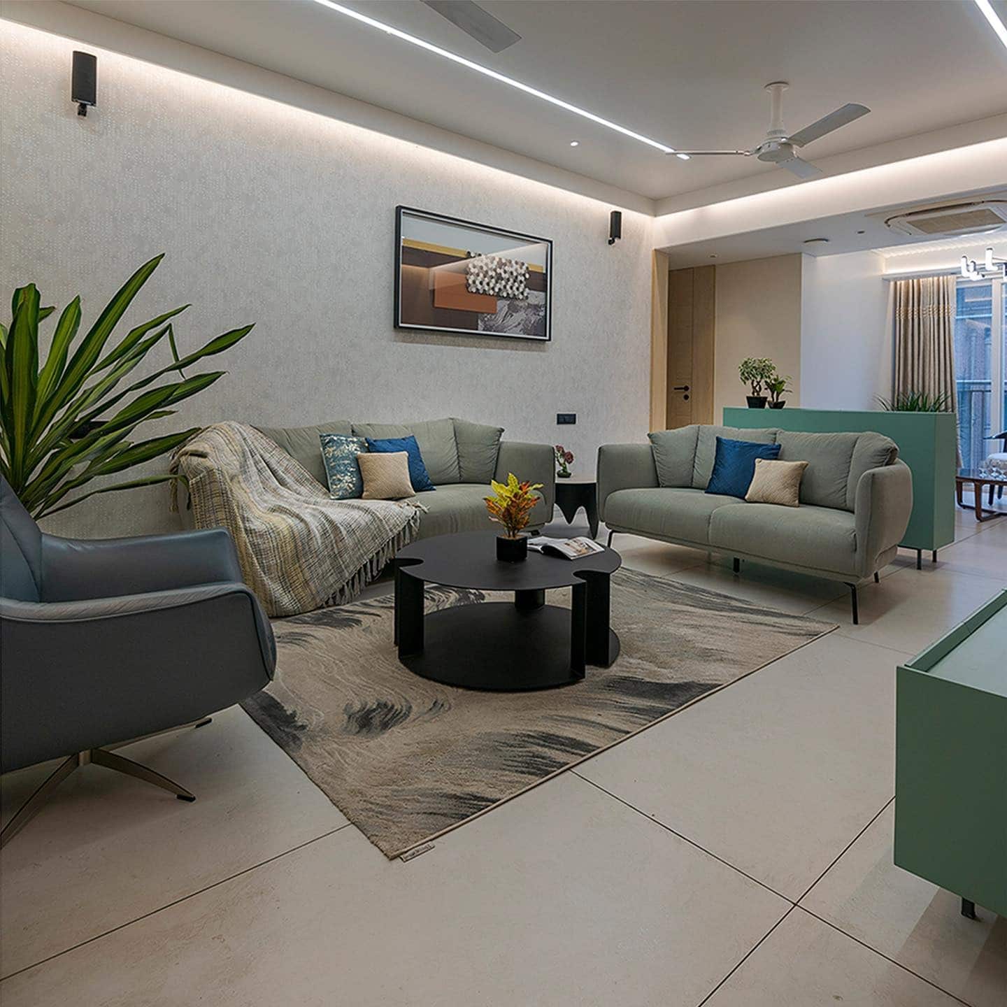 10. Soft Green Accents on Grey Foundation - grey floor living room ideas