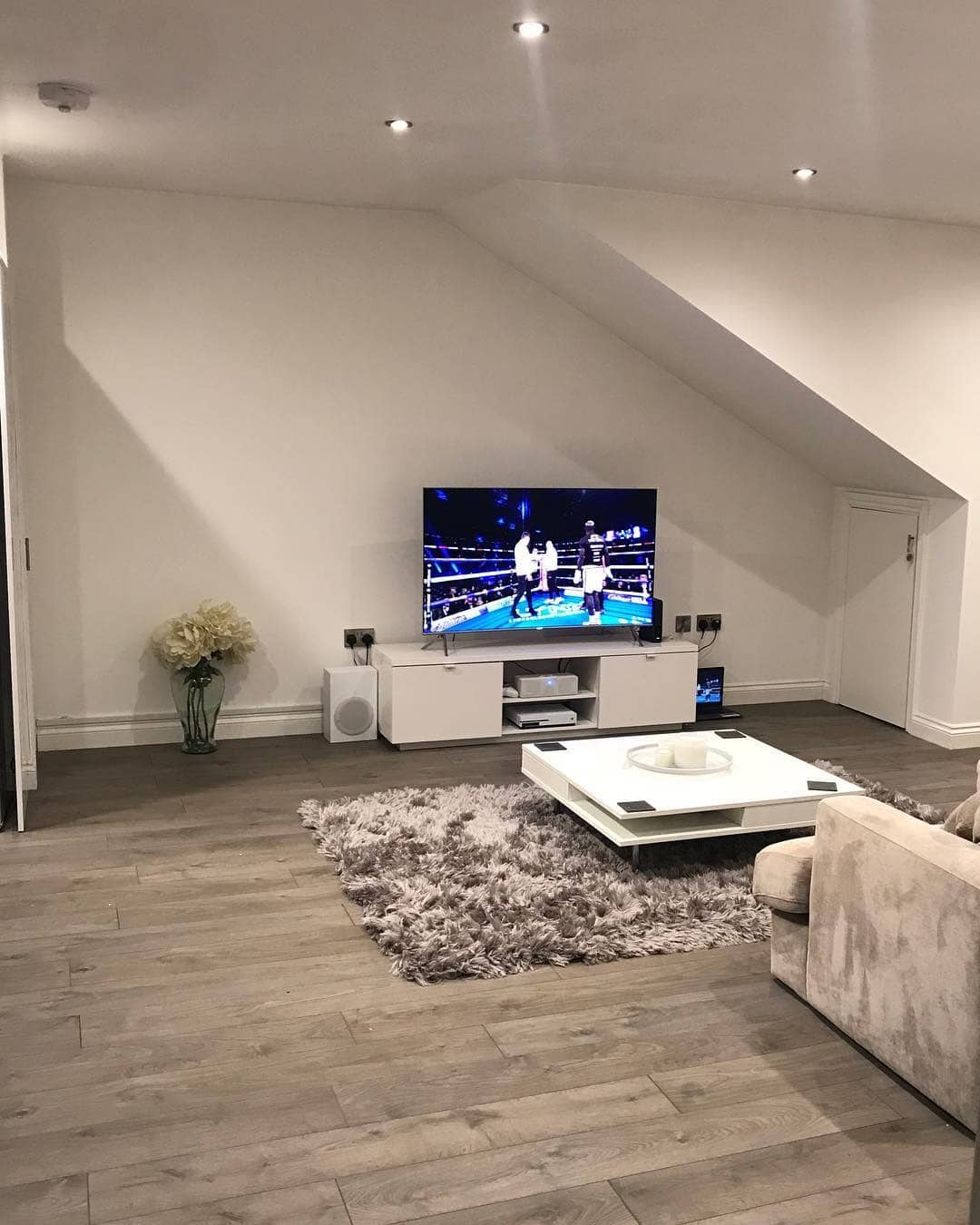 21. Modern Simplicity with Soft Textures - grey floor living room ideas