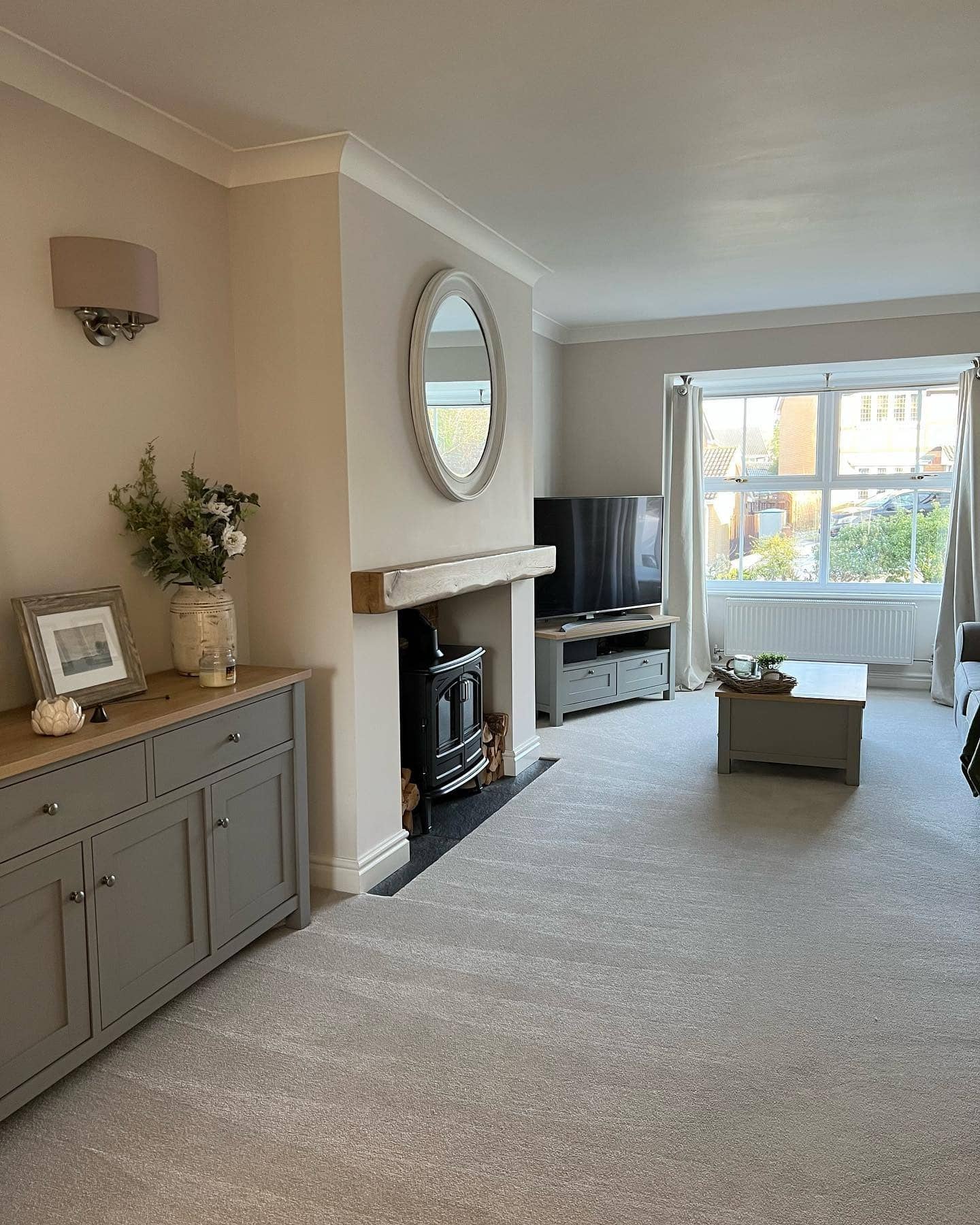 22. Classic Comfort with Grey Carpeting - grey floor living room ideas