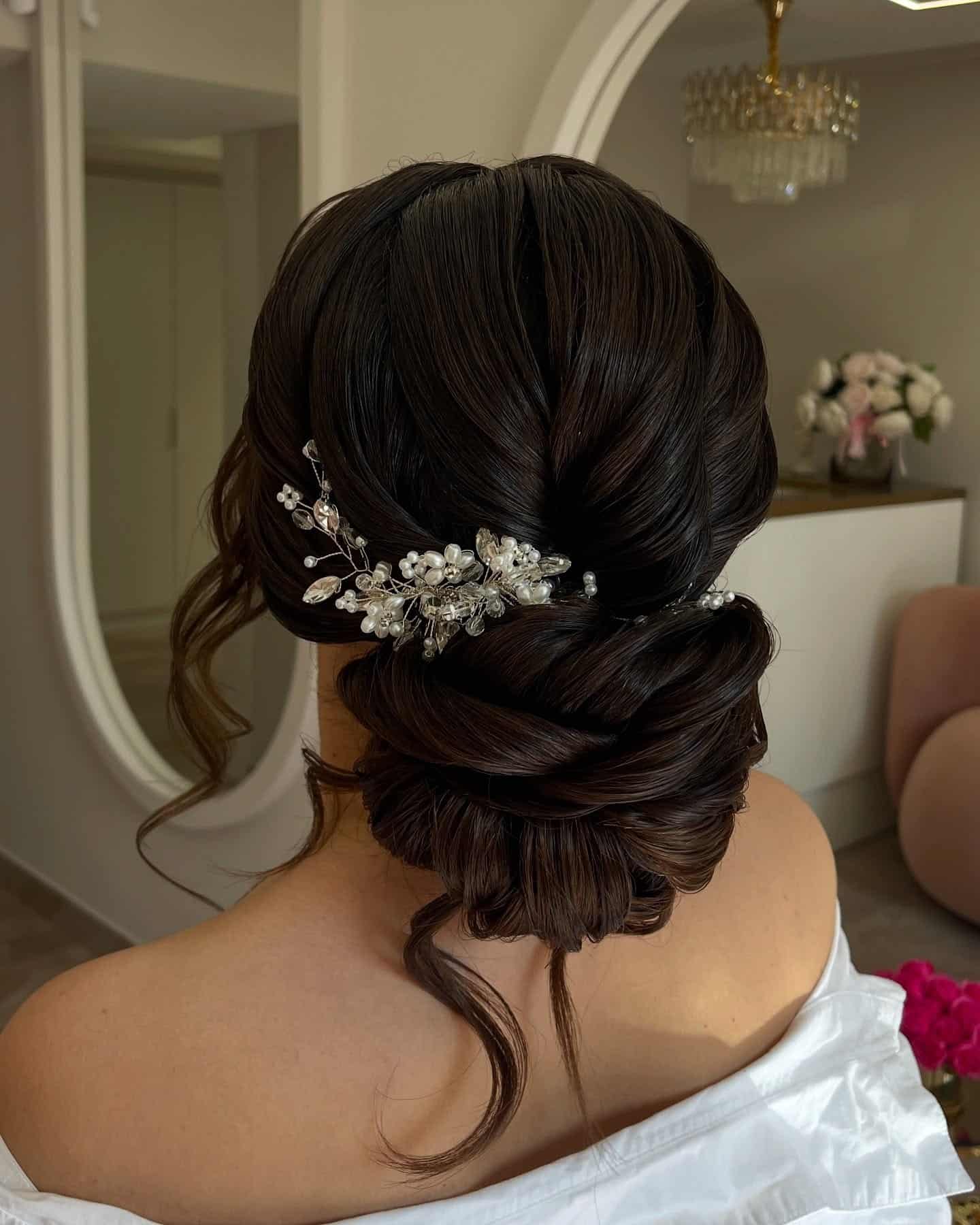 3. Polished Low Bun with Pearl Crystal Comb β Deep Brunette - Bride Hairstyles