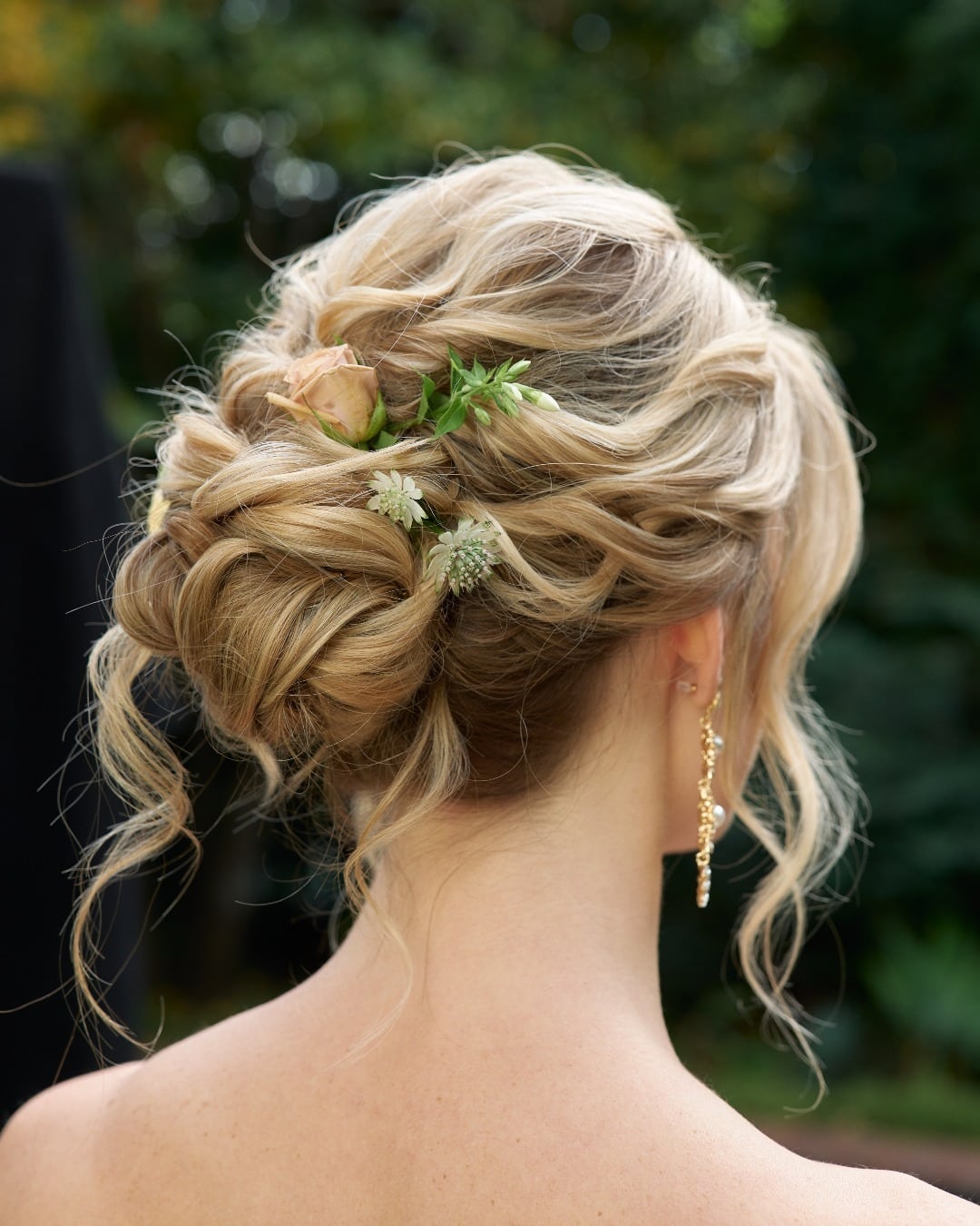13. Romantic Textured Updo with Fresh Flowers β Honey Blonde - Bride Hairstyles