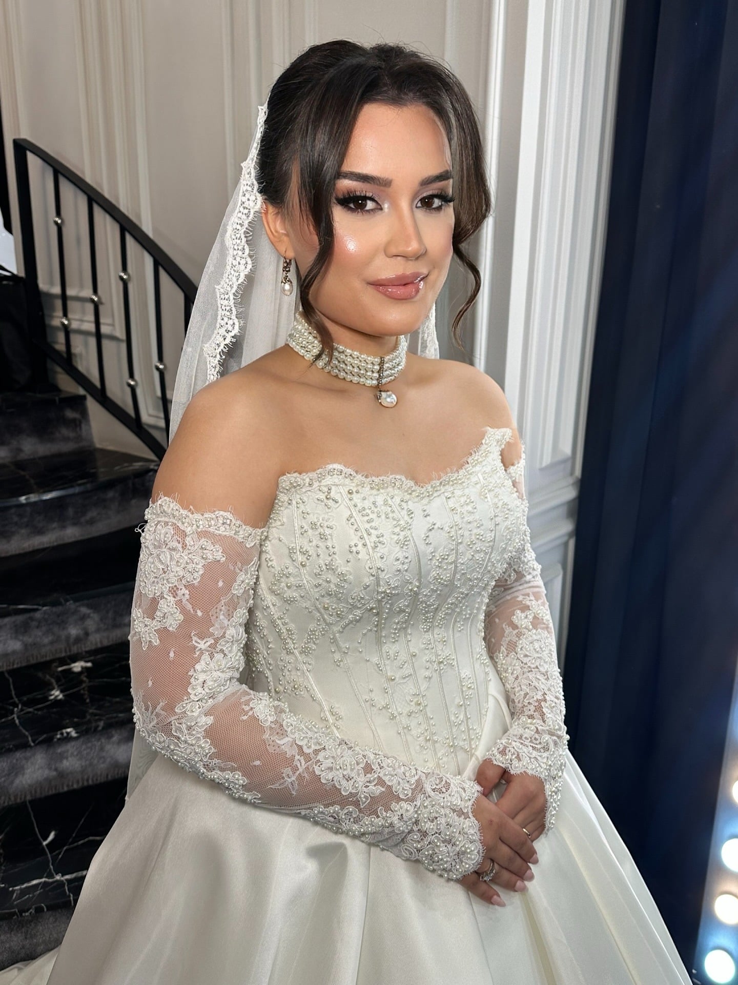 20. Low Bun with Soft Veil Placement β Warm Brunette Balayage - Bride Hairstyles