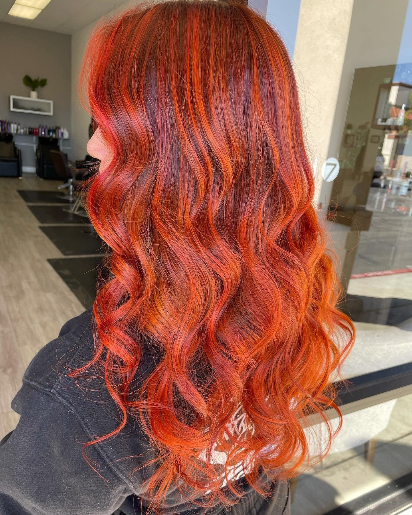 19. Lava Glow Curls - Red Orange Hair Color