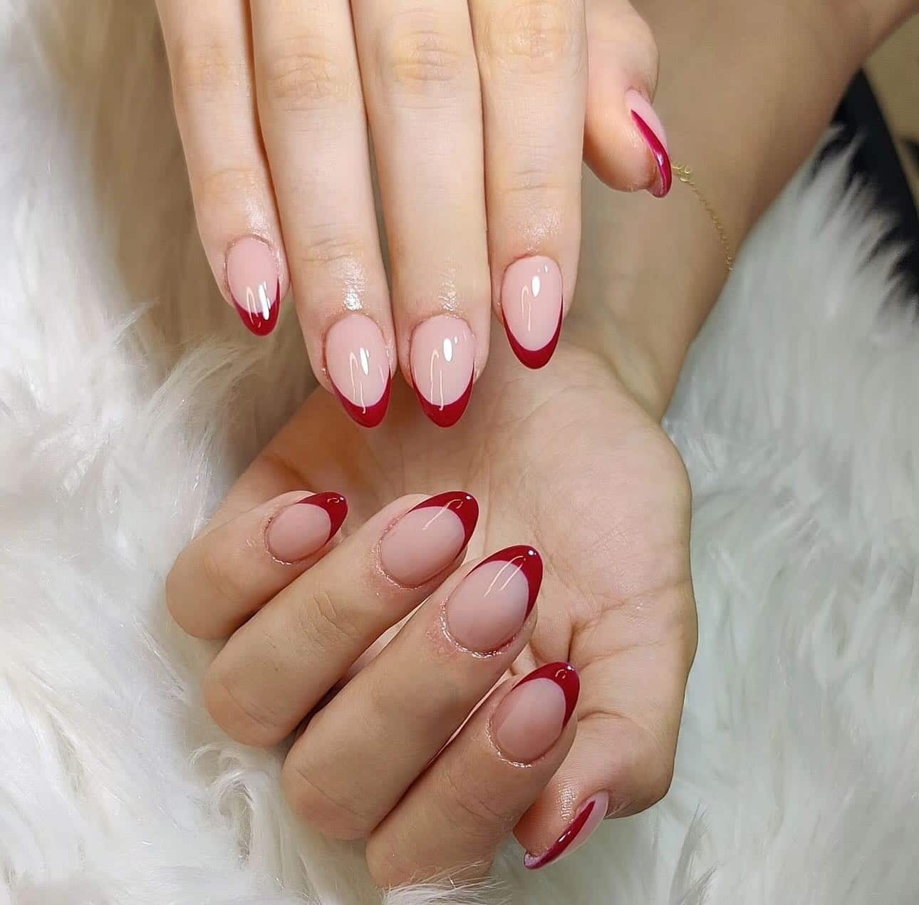 2. Classic Almond Red French Tips - red french tip nail ideas
