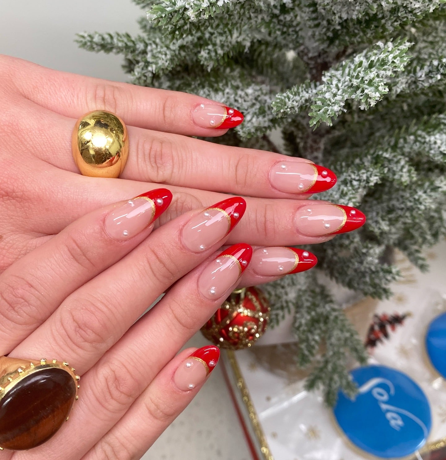 3. Elegant Red French with Gold & Pearls - red french tip nail ideas