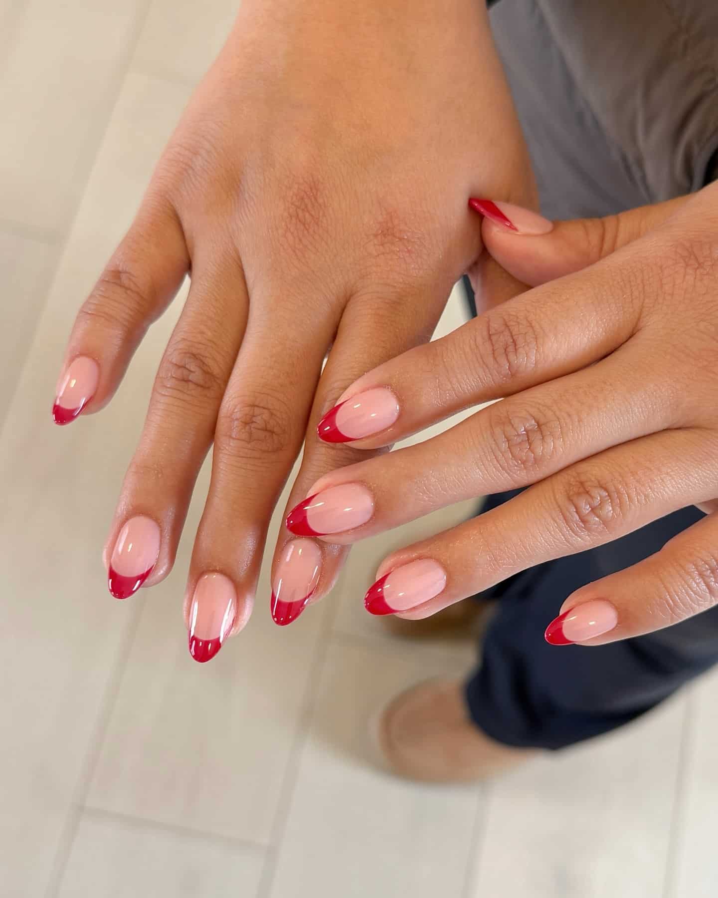 7. Minimal Almond Red French Tips - red french tip nail ideas