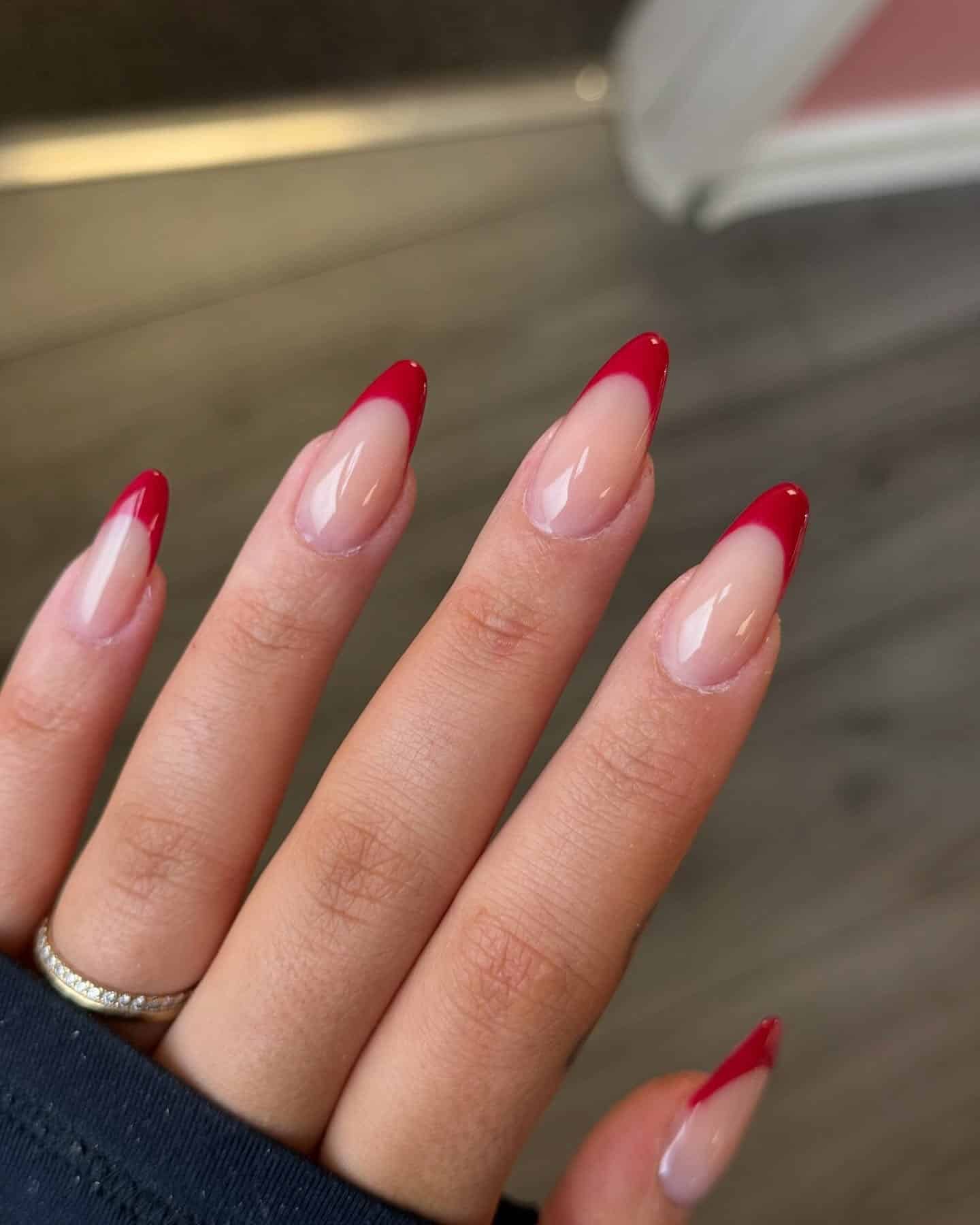 18. Sleek Almond Red French Tips - red french tip nail ideas