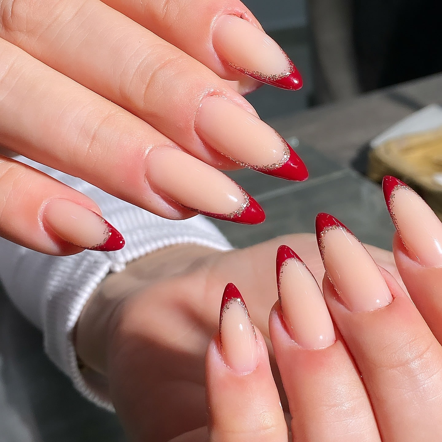 22. Almond Red French Tips with Glitter Detail - red french tip nail ideas