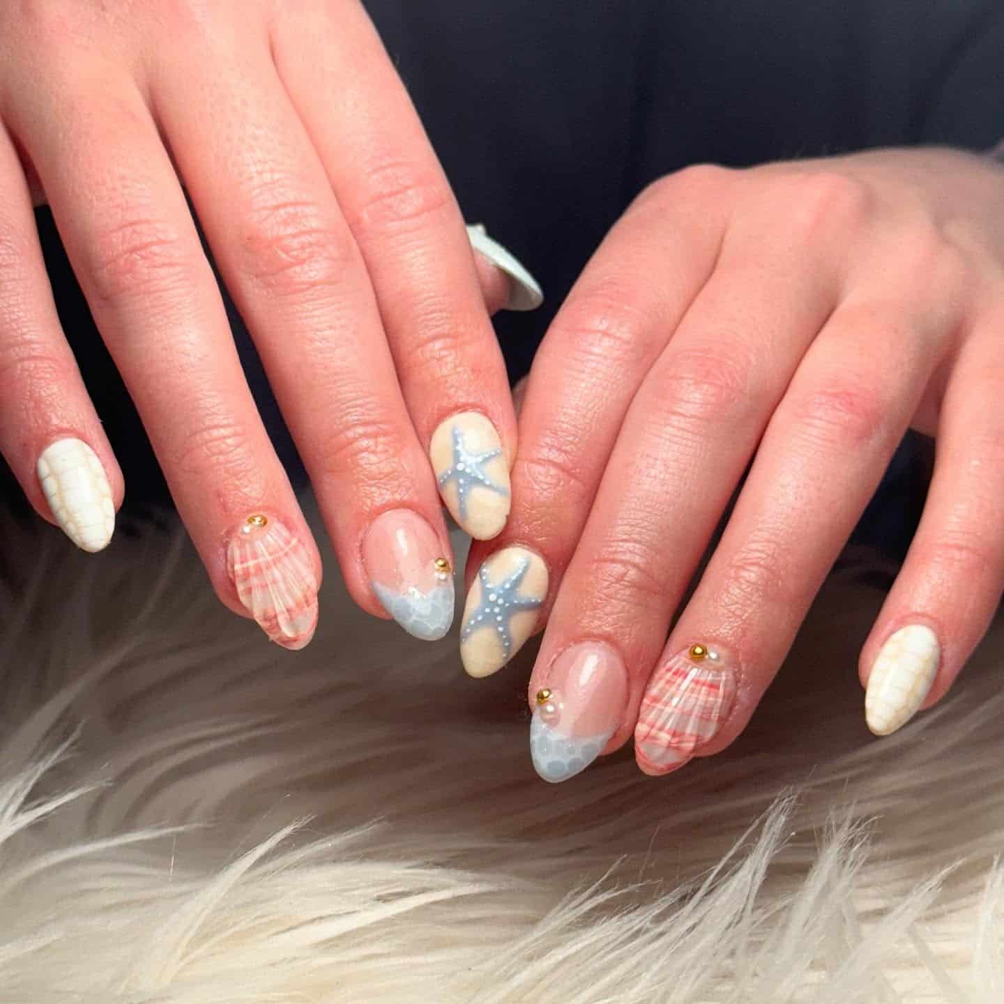21. Starfish & Shell Harmony - shell nail ideas