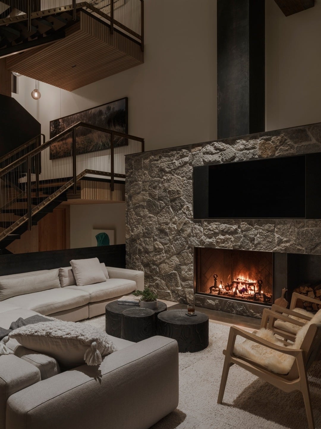 2. Stone Fireplace Elegance - cabin living room ideas