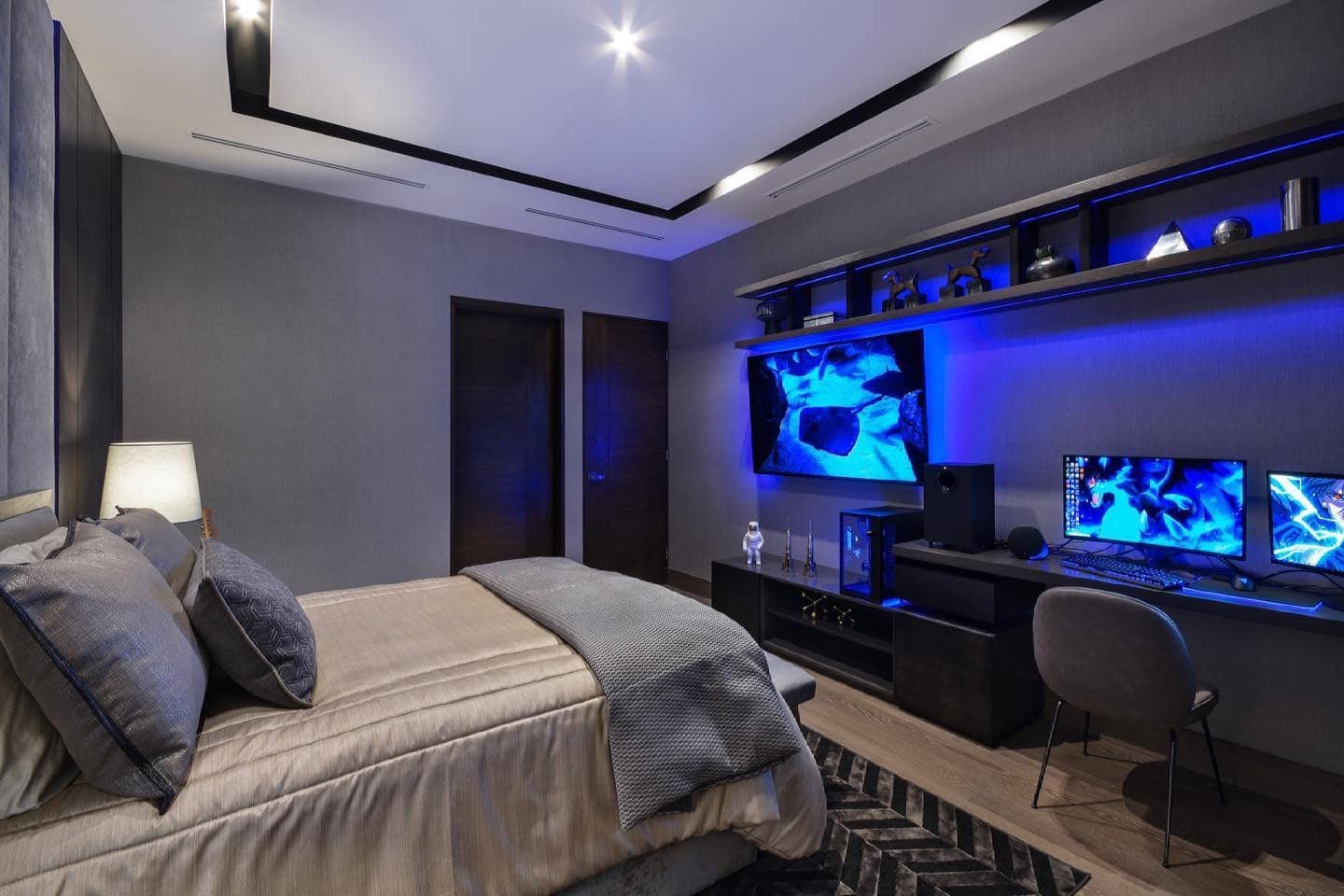14. Blue-Toned Luxury Gaming Bedroom - gaming bedroom ideas