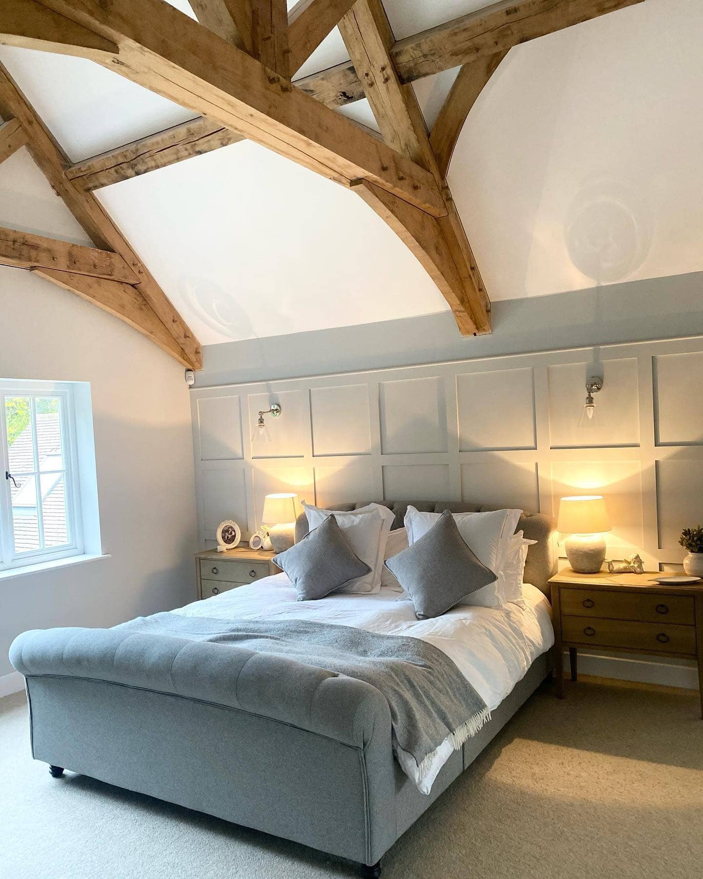 16. Exposed Oak Beams with Modern Paneling - oak bedroom ideas