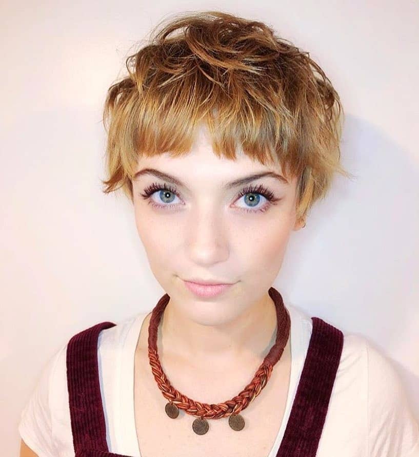 22. Golden Tousled Pixie with Baby Bangs - Choppy Pixie Haircuts