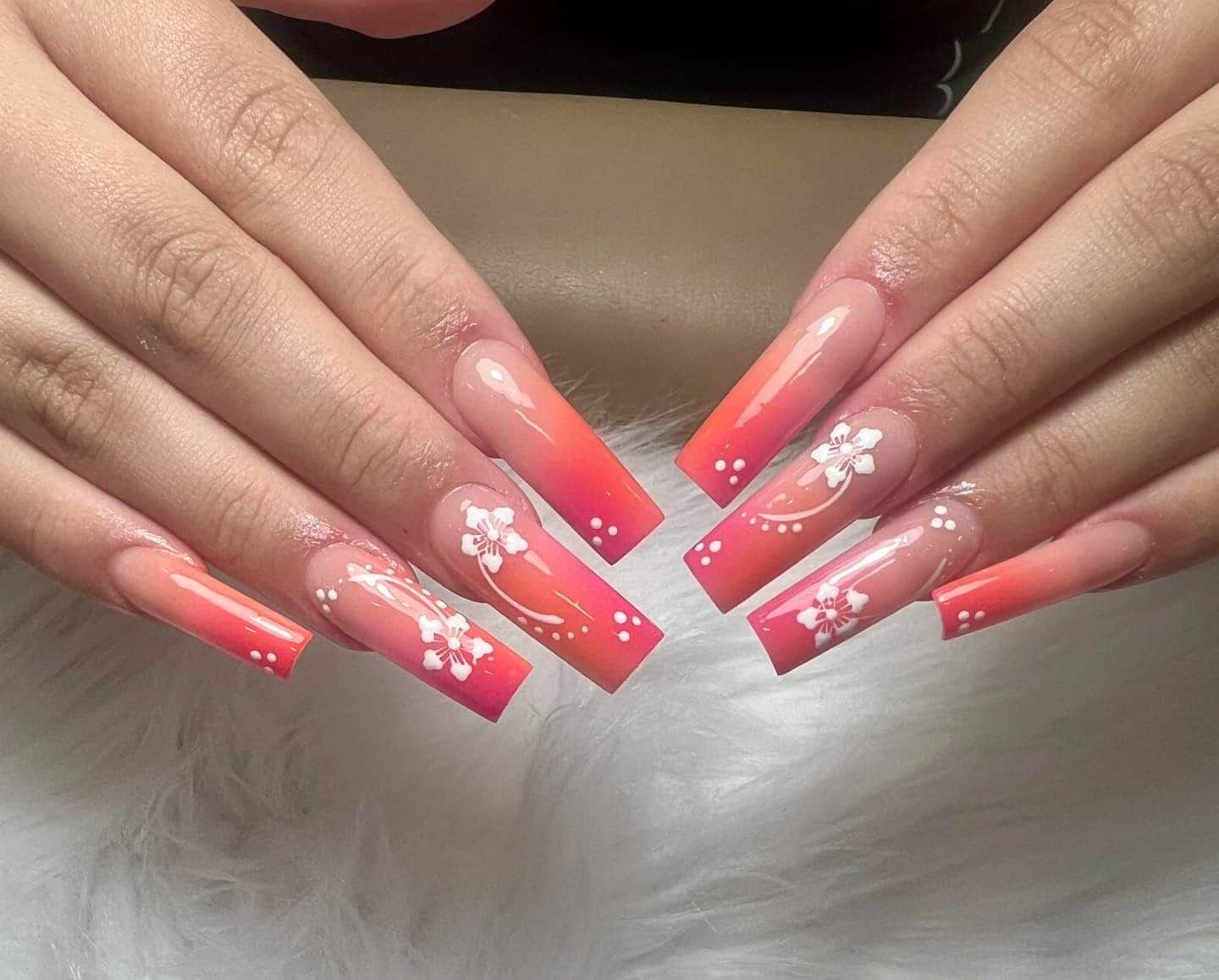 12. Sunset Ombre with Floral Accents - shiny nail ideas