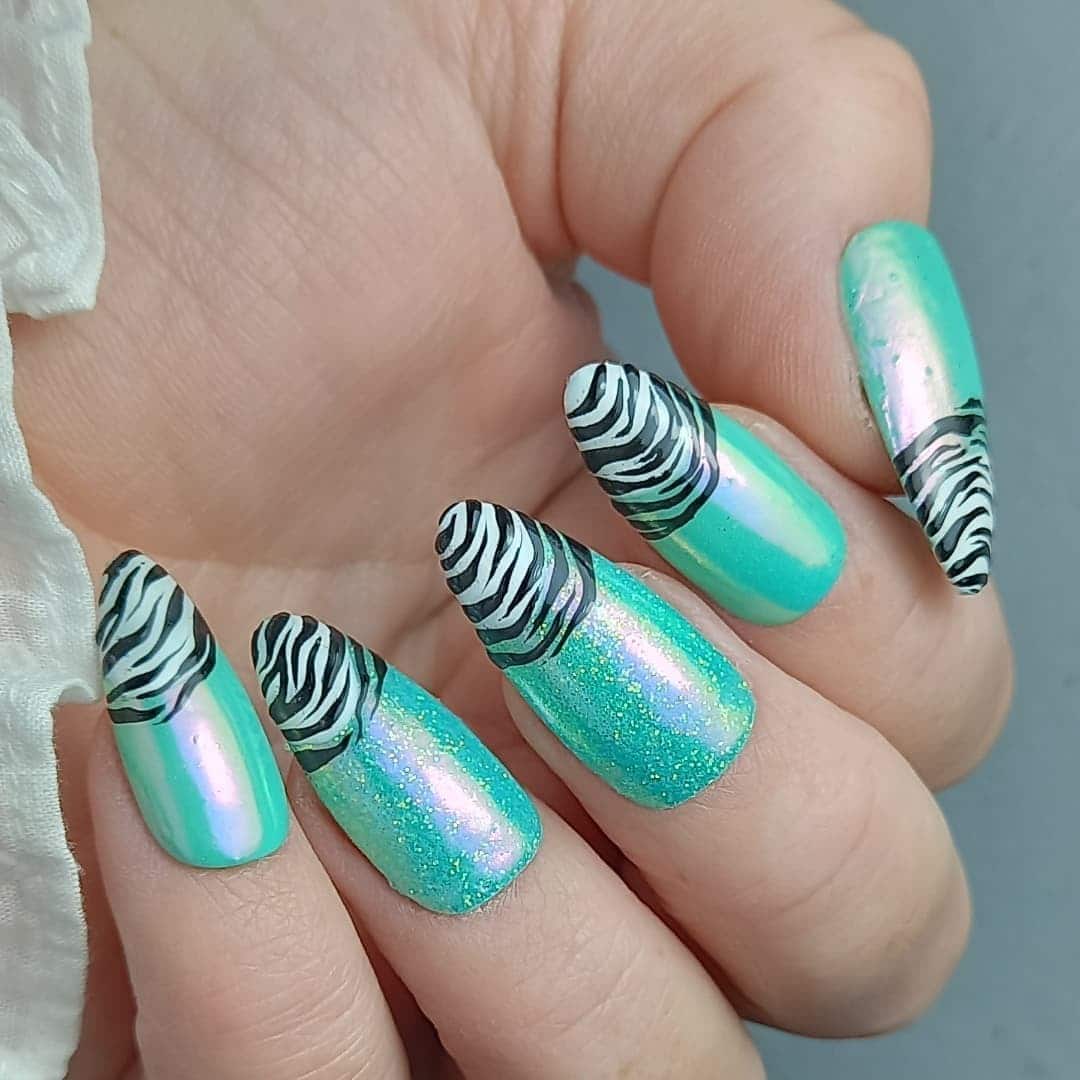13. Aqua Sparkle with Zebra Tips - shiny nail ideas