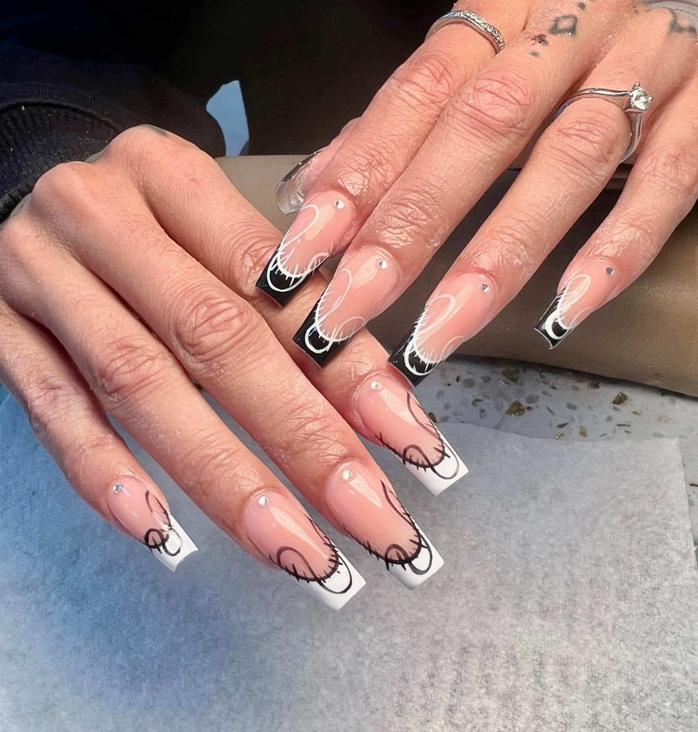 15. Modern French with Graphic Swirls - shiny nail ideas