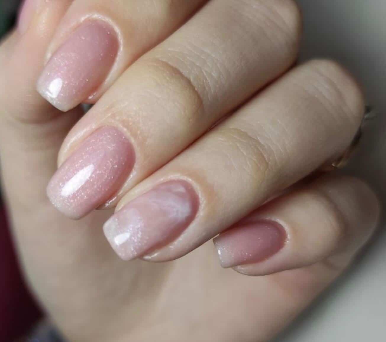 20. Soft Pink Shimmer Marble - shiny nail ideas