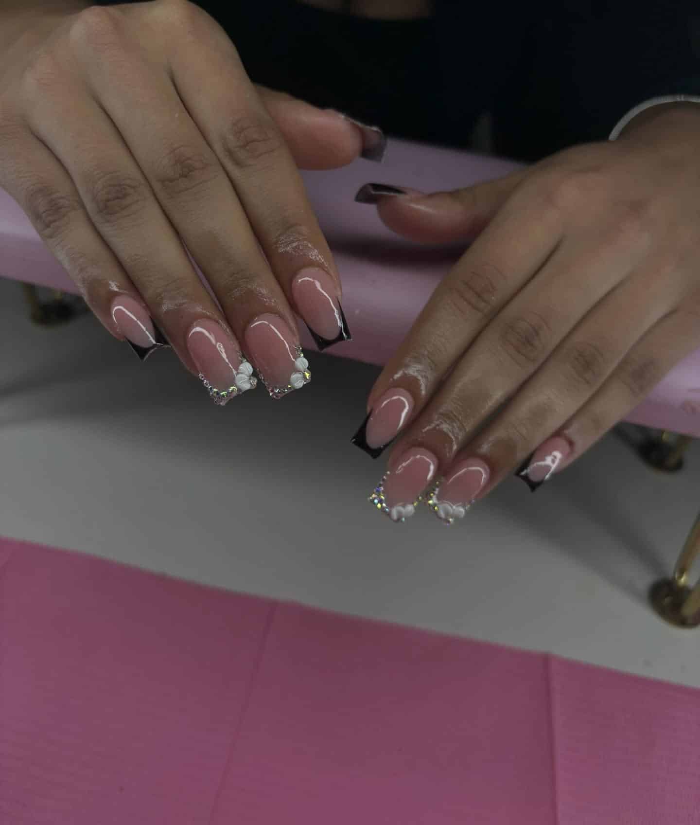 9. Glamorous Black French with Rhinestones - short french nail ideas