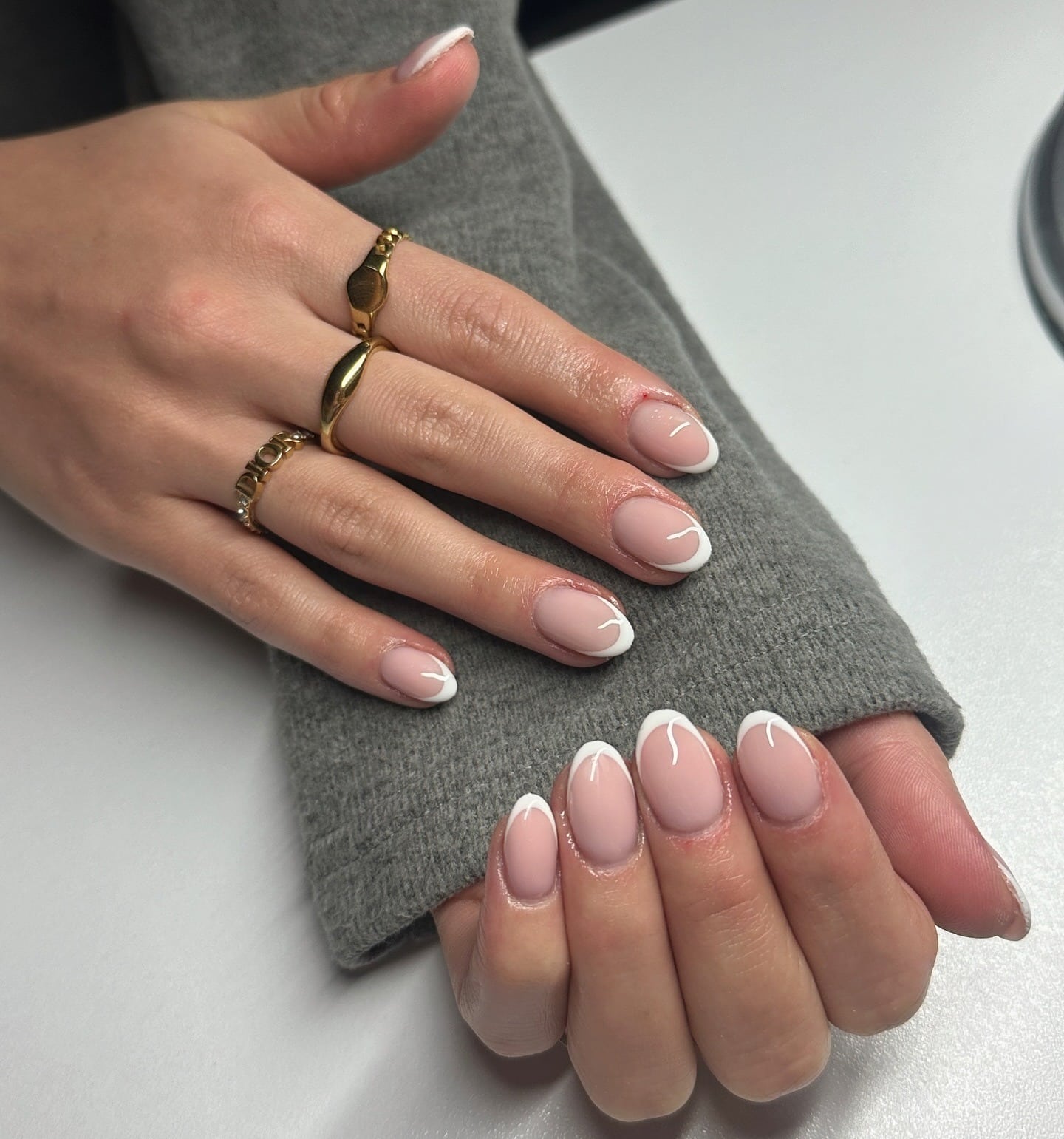 16. Curved French with Swirls - short french nail ideas