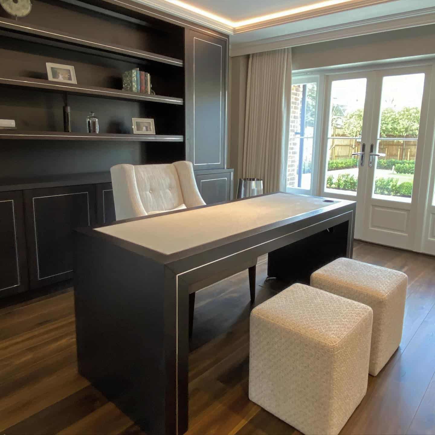 1. Modern Elegance with Natural Light - black desk office ideas