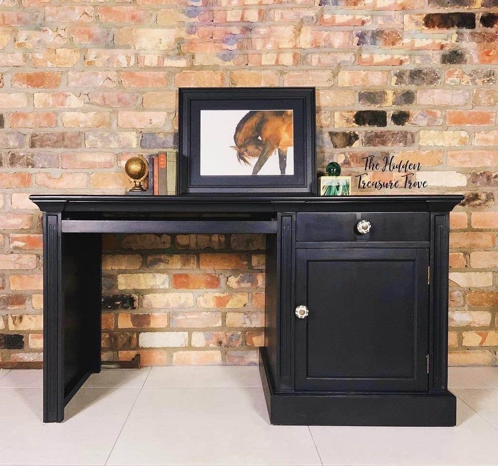 2. Classic Charm Against Exposed Brick - black desk office ideas