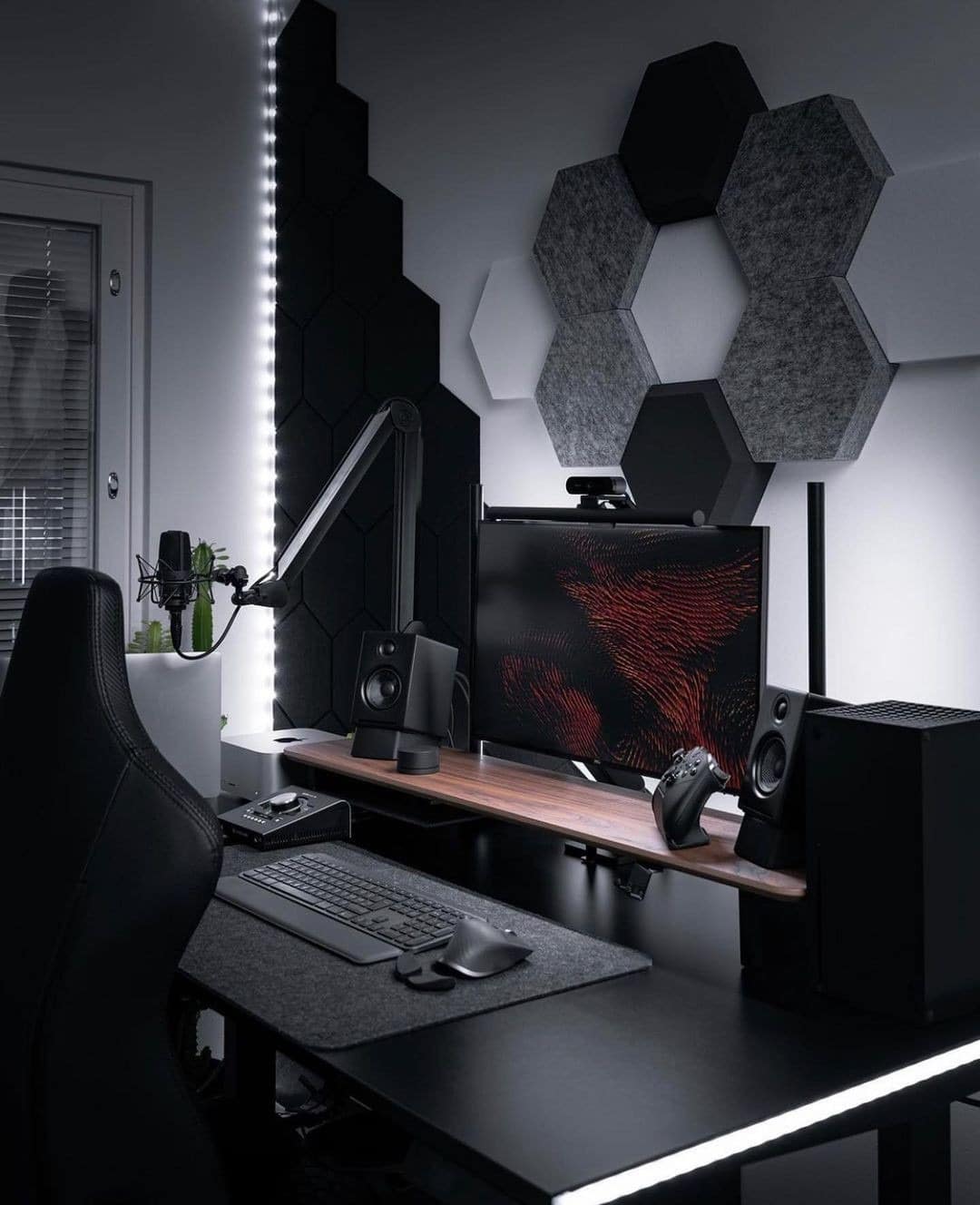 10. Monochrome Gamer’s Retreat - black desk office ideas