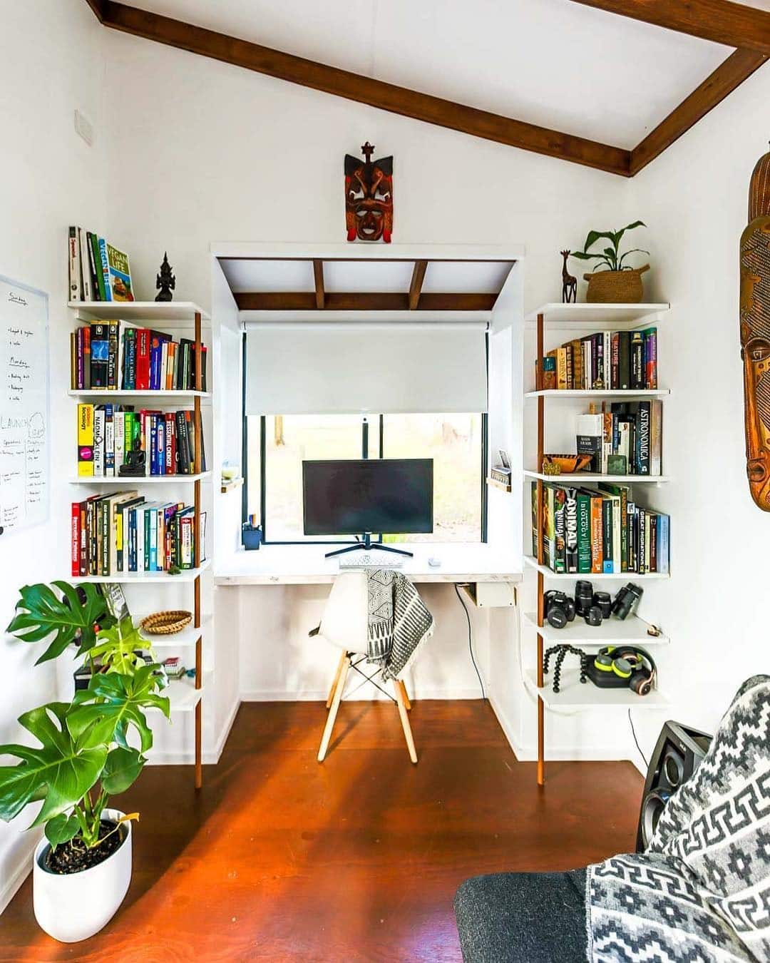 11. Library-Style Workspace with White Shelves - tiny home office ideas