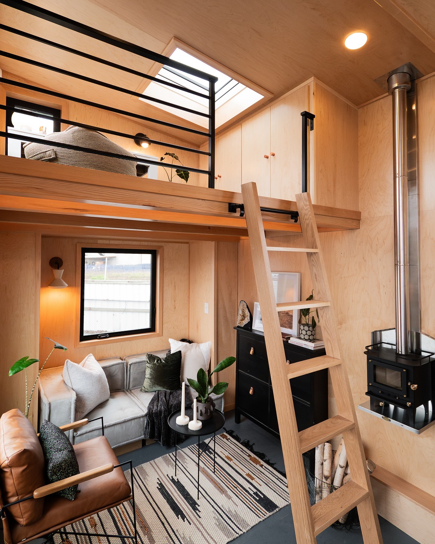 16. Modern Loft Living with Flexible Work Space - tiny home office ideas