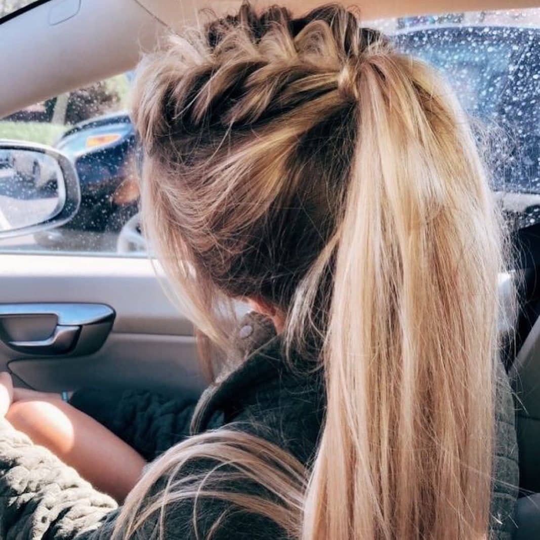 6. Voluminous French Braid into High Ponytail on Golden Blonde Hair - Volleyball Hairstyles