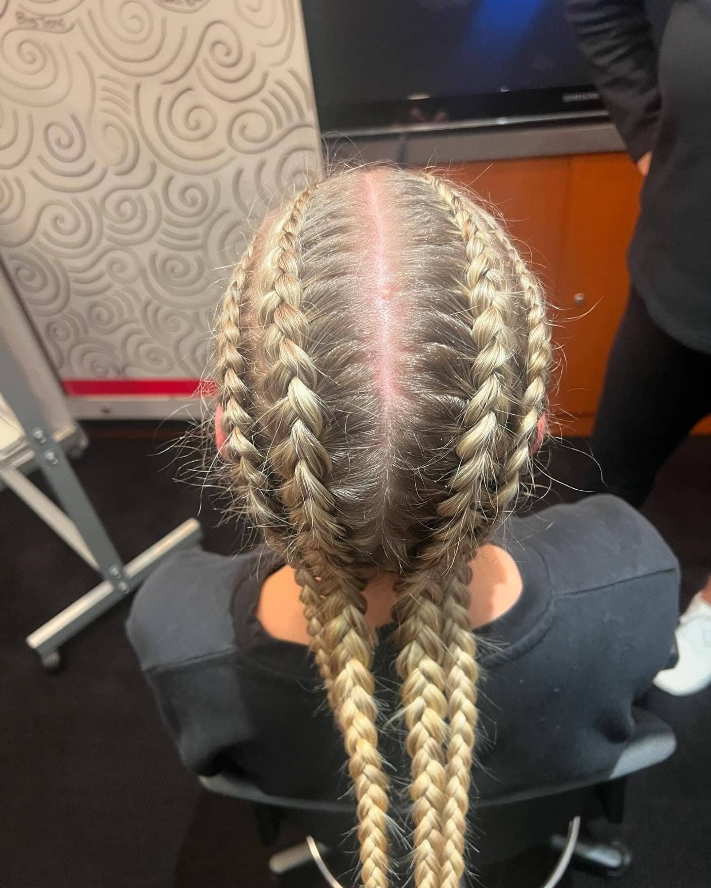 7. Four Dutch Braids into Twin Ponytails on Platinum Blonde Hair - Volleyball Hairstyles