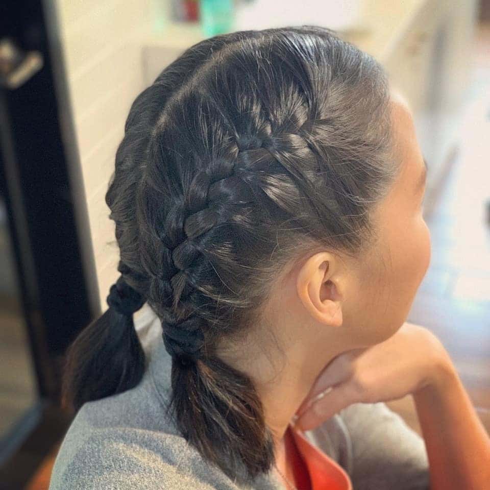 10. Double Dutch Braids into Low Pigtails on Black Hair - Volleyball Hairstyles