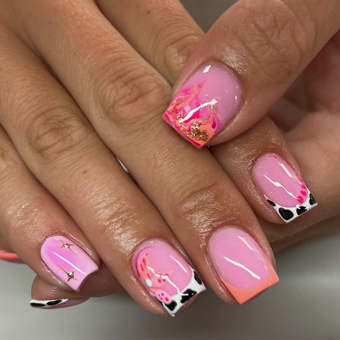 2. Square Pink Mix with Cow Print and Gold Foil - short pink nail ideas
