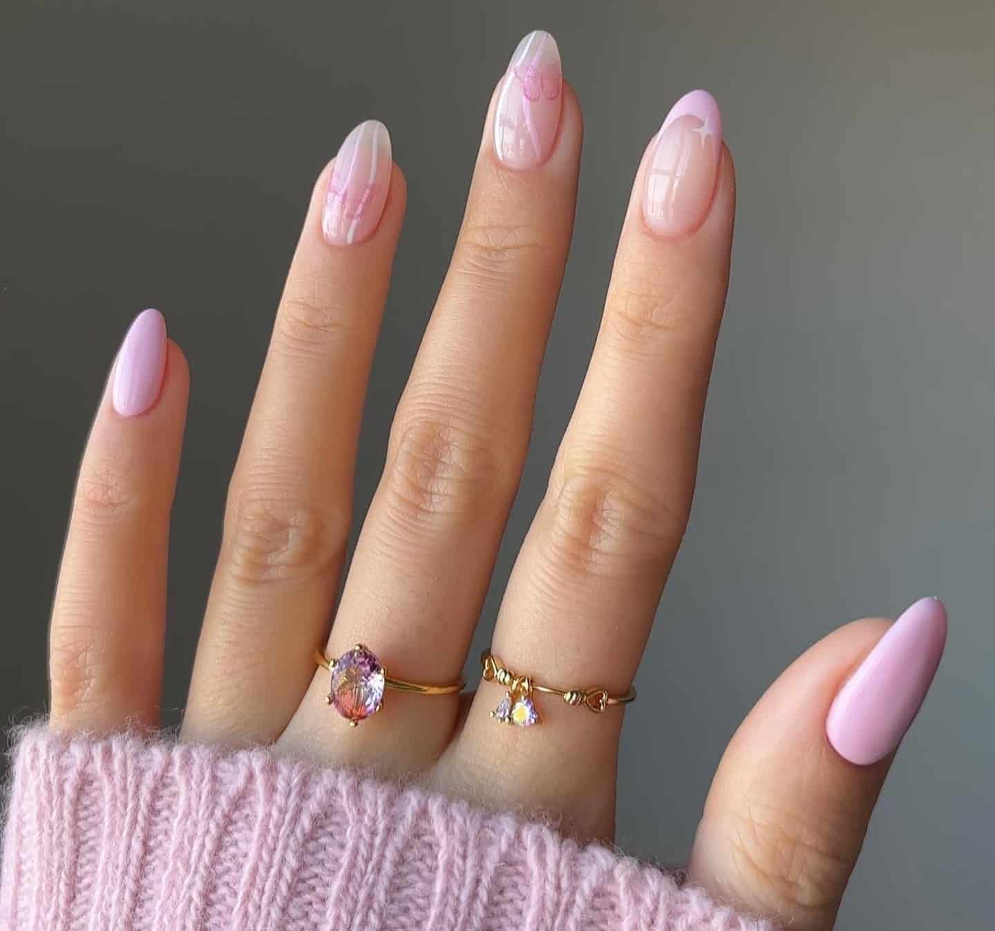 13. Soft Almond Pink with Butterfly Accents - short pink nail ideas