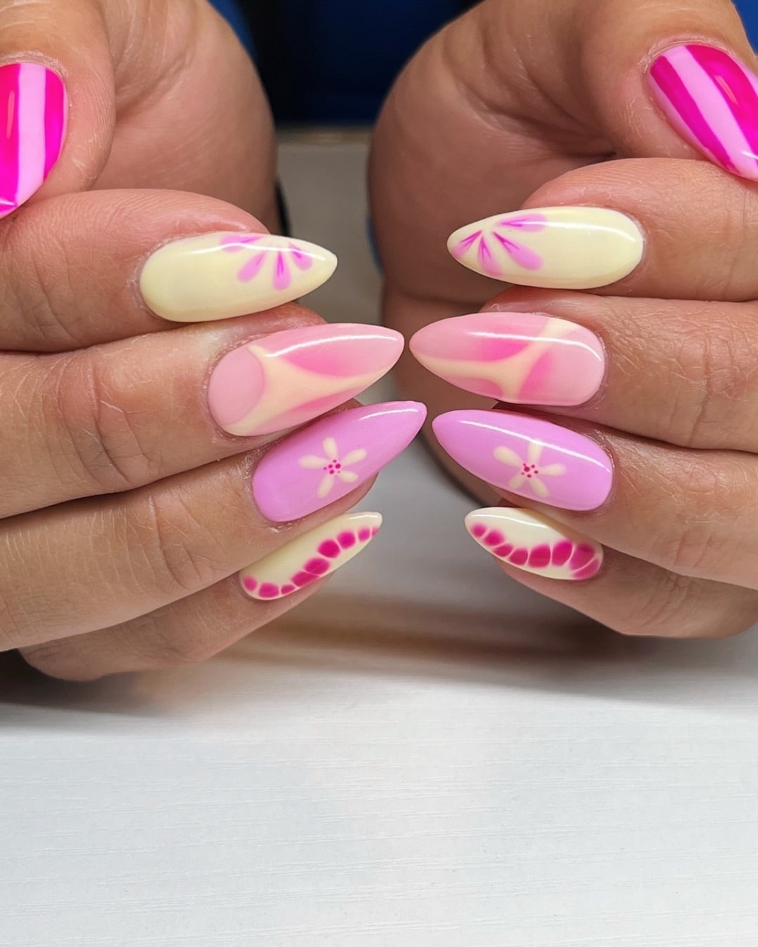 14. Almond Pink and Cream Mix with Florals - short pink nail ideas