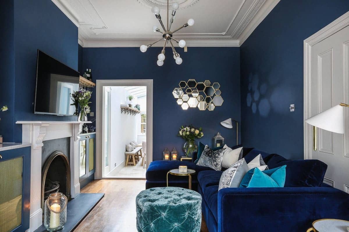 8. Modern Glam with Metallic Touches - navy blue living room ideas