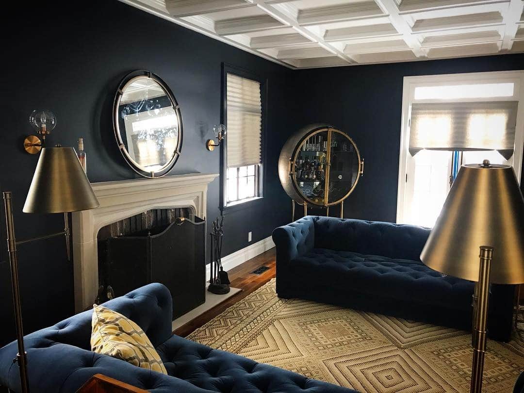 20. Dramatic Navy with Statement Lighting - navy blue living room ideas