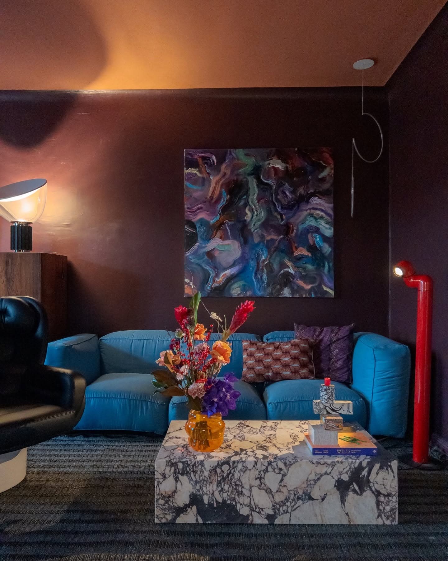 2. Artistic Edge with Bold Contrast - urban living room ideas