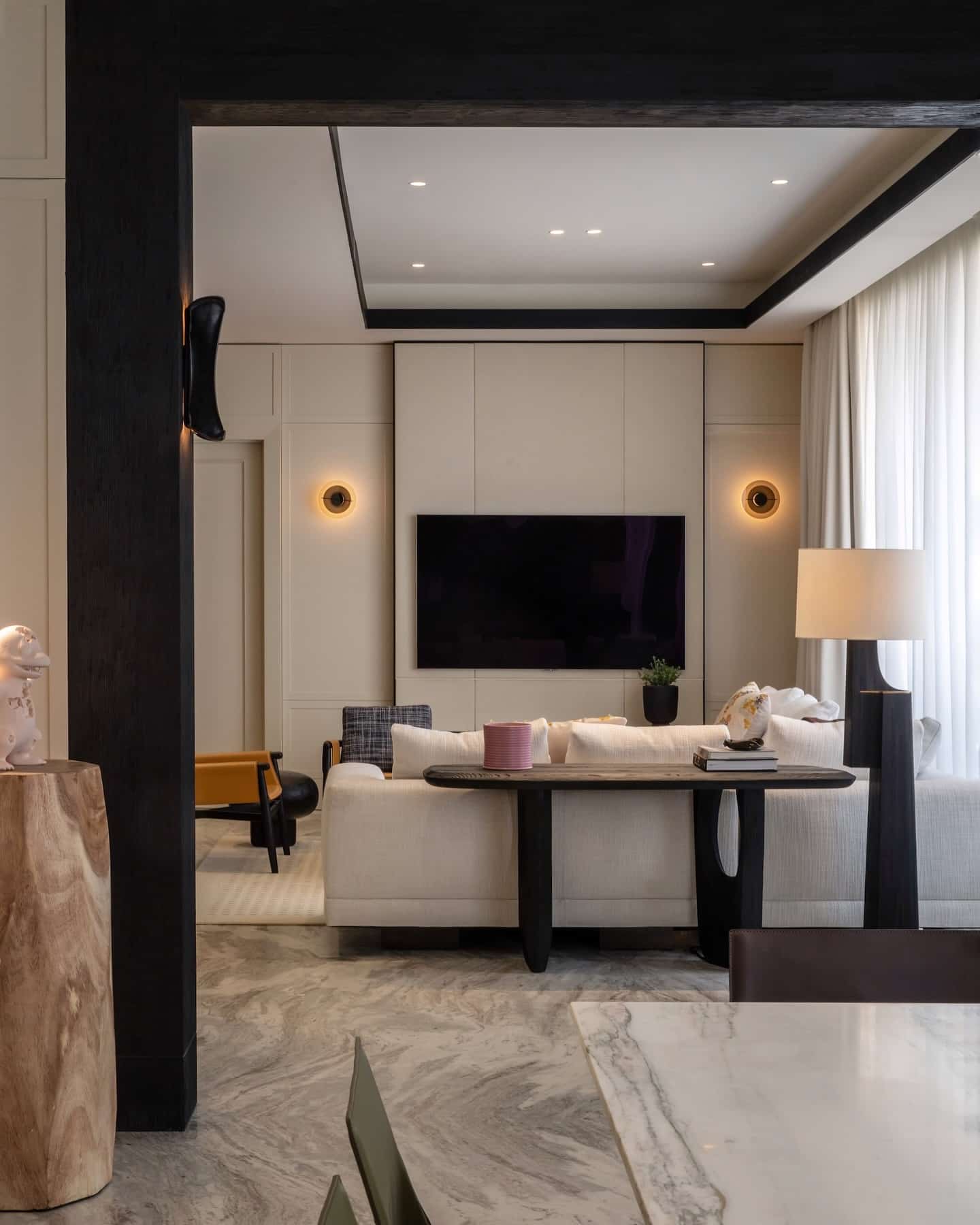 11. Refined Contrast with Marble Detailing - urban living room ideas