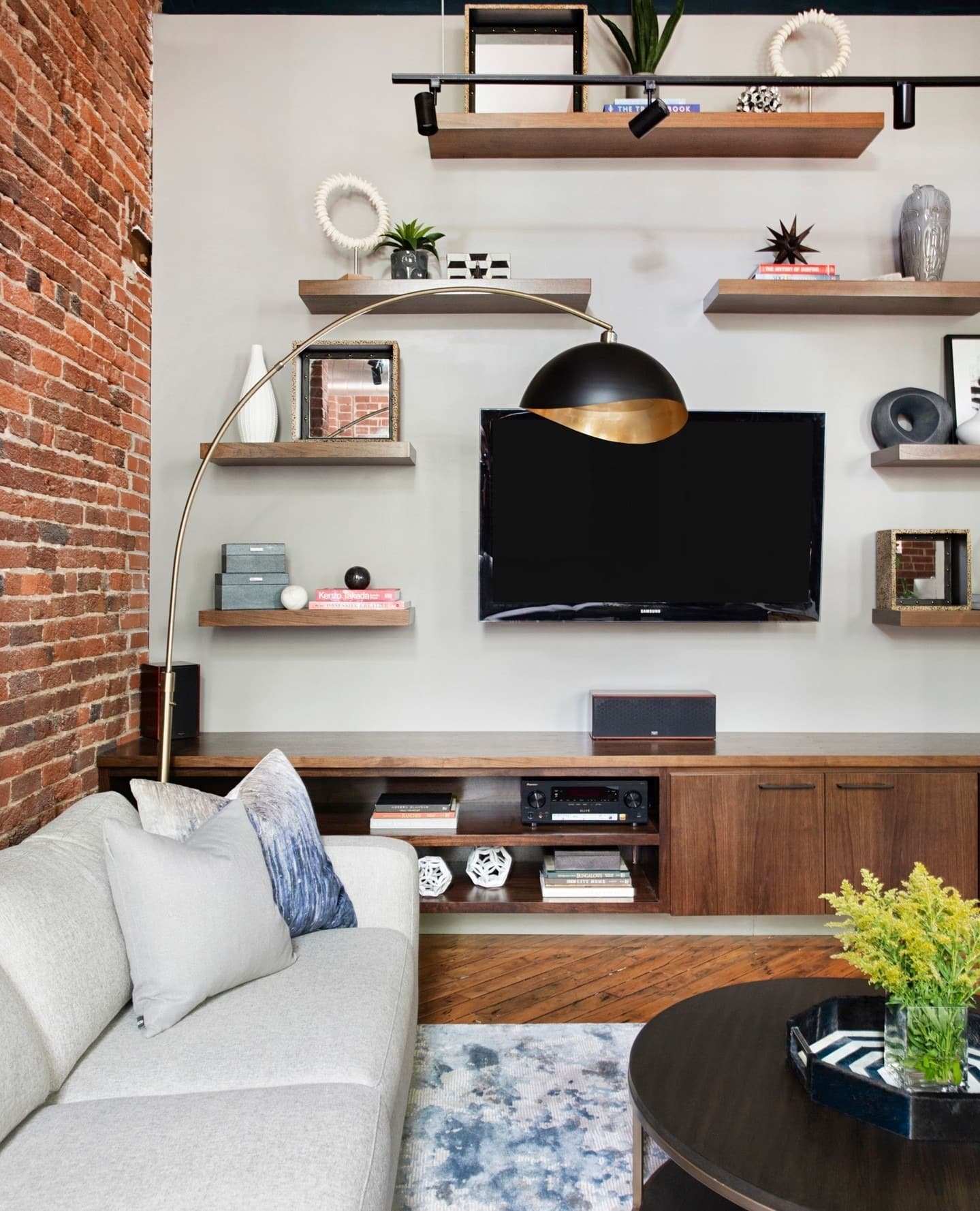 21. Industrial Warmth with Brick and Wood - urban living room ideas