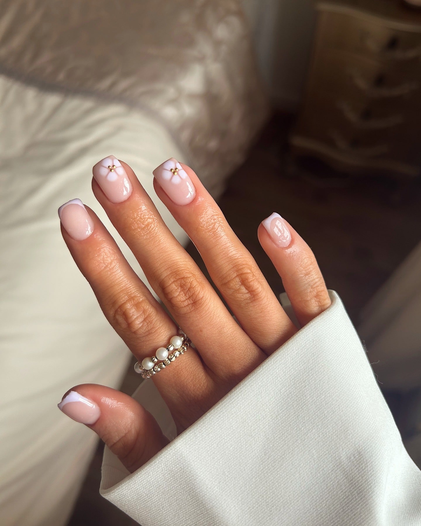 11. Soft Pink French with Dainty Flowers - simple short square nail ideas